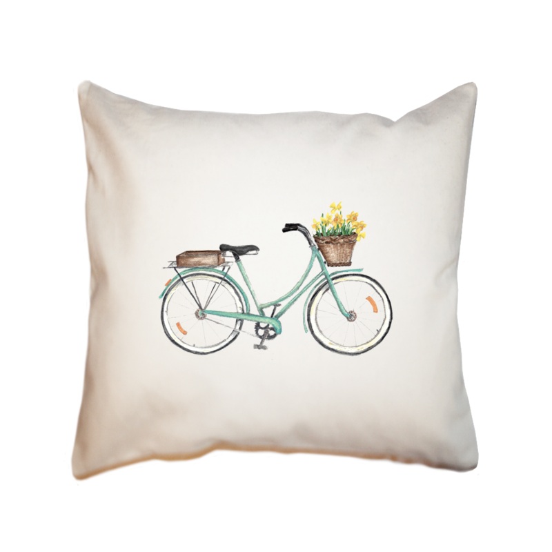 seafoam bike with daffodils in front square pillow