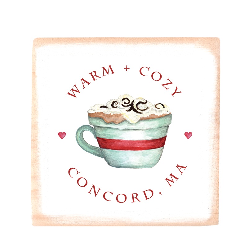warm and cozy cocoa cup with town wood block